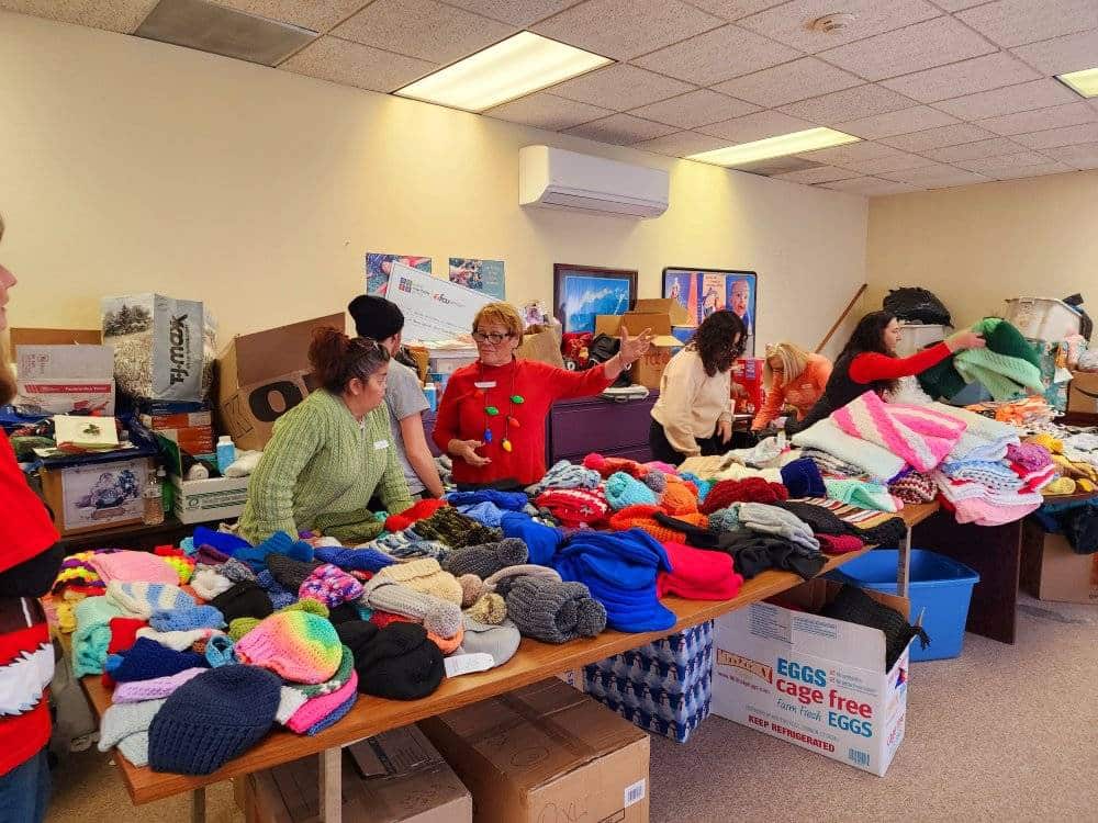 Taunton Operation Christmas group of women volunteers organize knitted clothes for Operation Christmas children