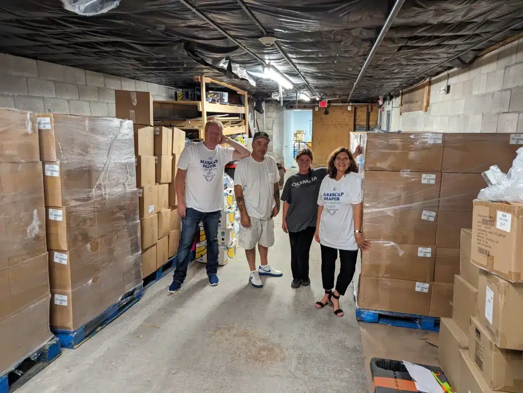 CFC/MASSCAP Diaper Program The CFC Diaper team stands in the middle of the first diaper delivery
