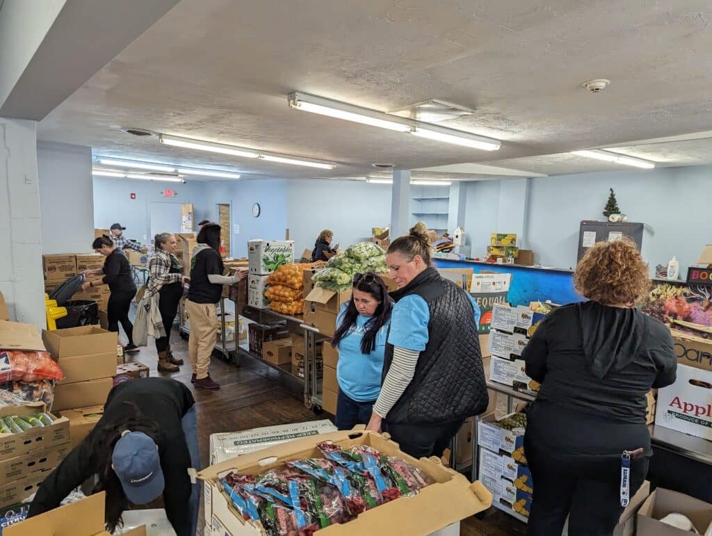 CFC Food Pantry volunteers hustle preparing food boxes for food pantry clients